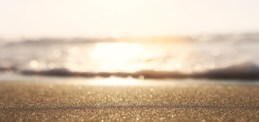 Sea waves and warm sunset light, calm and relaxing sandy beach - obrazy, fototapety, plakaty