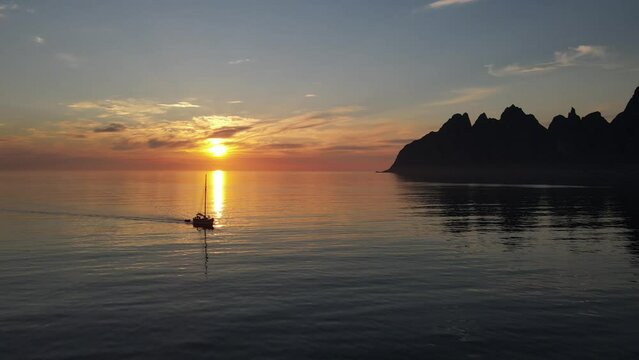 A sailboat in the midnight sun in Northern Norway, Senja