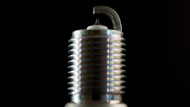 Close-up. Automotive spark plug with thin iridium electrode