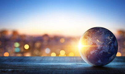 Planet earth on the background of blurred lights of the city. Concept on business, politics,...