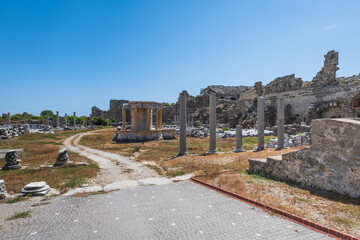 Side Ancient Ruins touristic site in the popular resort town of Side, near Antalya, Turkey. Ancient ruin with Greek amphitheatre.