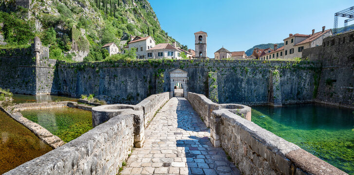 Panoramic view of nord river gate, ancient fortress and church of St. Mary in Old Town of Kotor. Kotor, Montenegro.