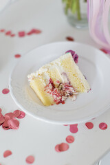 Slice of birthday cake with berries