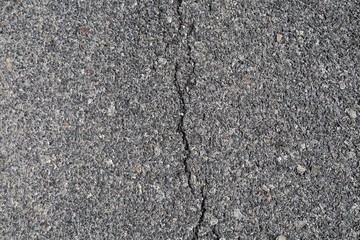 Asphalt pavement has cracks or splits due to loads from overloaded trucks or overloaded trucks...