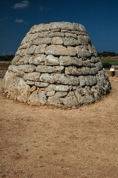 long shot of the naveta de Es Tudons, funerary monument on the Spanish island of Menorca