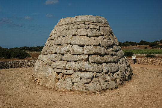 long shot of the naveta de Es Tudons, funerary monument on the Spanish island of Menorca