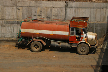 water tanker truck parked at construction site