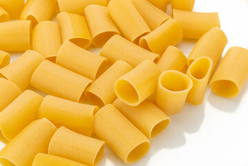 Paccheri pasta isolated on white, typical Italian macaroni from Gragnano