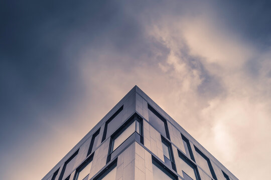 Modern Office Building Against Dramatic Sky.