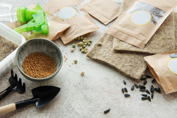 Microgreen seeds in paper bags and equipment for sowing microgreens.