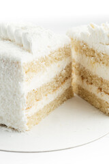 cake with coconut flakes on white background