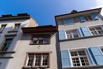 Fototapeta na wymiar Medieval old town of City of Basel with beautiful historic houses on a blue cloudy spring day. Photo taken April 27th, 2022, Basel, Switzerland.