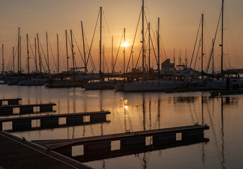 Fototapeta premium ships moored in the port of la linea de la concepcion in front of gibraltar at sunset