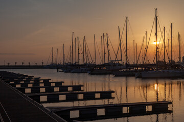 ships moored in the port of la linea de la concepcion in front of gibraltar at sunset