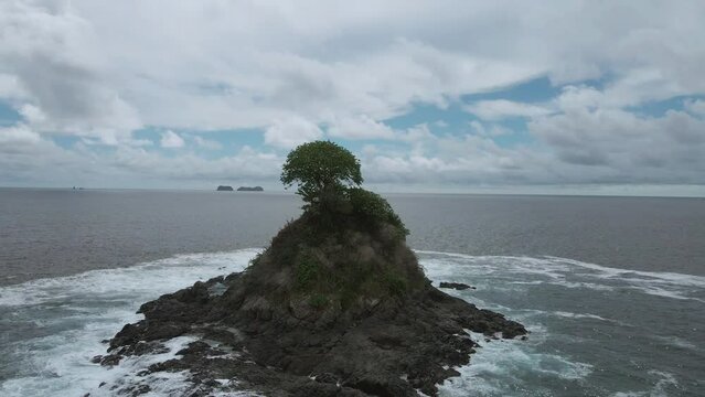 Danta Beach in Guanacaste, Las Catalinas town, Costa Rica. aerial drone shot tropical beach. Islet with tree