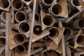 close up of stacked pipes for the irrigation of a cereal field