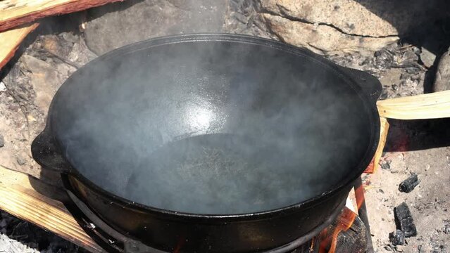 at the stake, black, bonfire, cauldron, close-up, cook, cooking, delicious, dinner, dishes, fire, firewood, flame, food, gourmet, hot, kitchen, lunch, material, metal, national cuisine, natural, objec