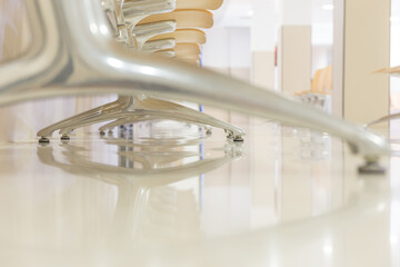 Hospital waiting room with chairs and reflections on the floor