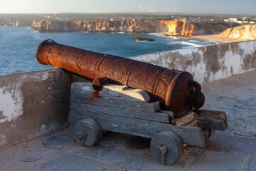 old defensive coastal battery facing the sea at sagres castle at sunset