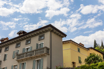Residential houses in the Italian town of Arco on Lake Garda under blue sky and light clouds