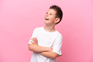 Little caucasian boy isolated on pink background happy and smiling