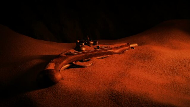 Pirate Gun In The Sand Lit Up In Firelight