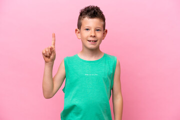 Little caucasian boy isolated on pink background pointing up a great idea © luismolinero