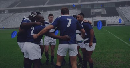 Animation of rugby balls with uruguay text over diverse male rugby players at stadium - Powered by Adobe