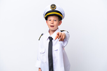 Little airplane pilot boy isolated on white background surprised and pointing front