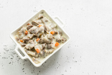 Healthy chicken stew, chicken gizzards, giblets, offal. Top view, copy space.