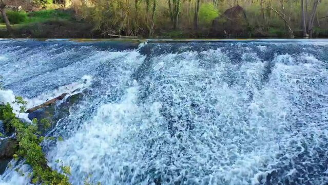 waterfall in Ega river in a rural area. Drone view. Iguzquiza, Navarre, Spain, Europe.