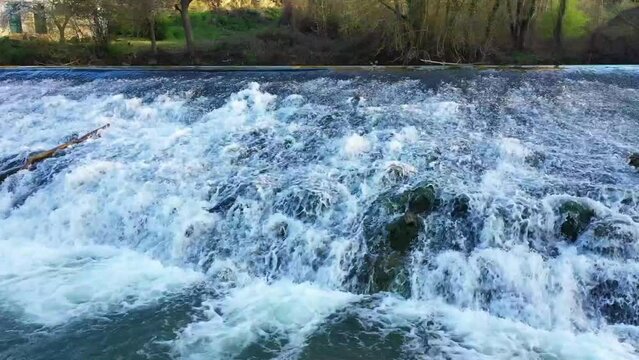 waterfall in Ega river in a rural area. Drone view. Iguzquiza, Navarre, Spain, Europe.