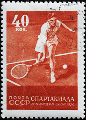 Tennis player on vintage russian postage stamp