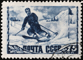 Vintage skier on old russian postage stamp