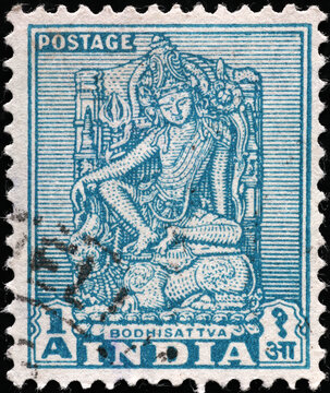 Statue of hindu goddess on vintage indian stamp