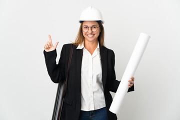 Middle age architect woman with helmet and holding blueprints over isolated background showing and lifting a finger in sign of the best