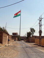Kurdish flag flying over the Citadel in Erbil, Kurdistan, Iraq