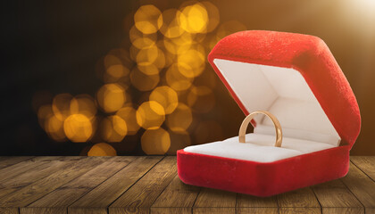 Gold ring, wedding ring in red box. The moment of a wedding, anniversary, engagement, or...