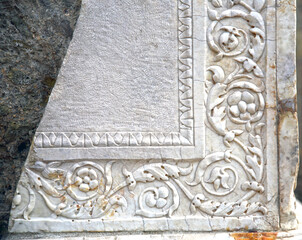 Detail of an ancient ruined stone with Roman decoration, Herculaneum, Campania, Italy