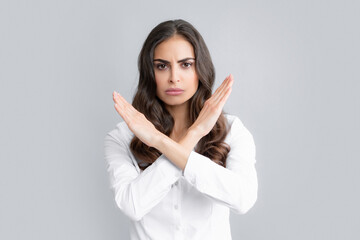 Negative woman crossed hands show no decline forbidden rule isolated over gray background....