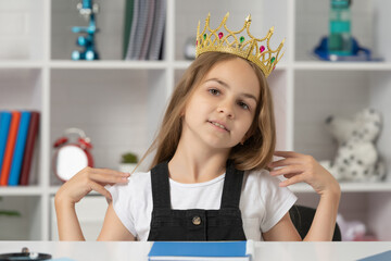 arrogant child in queen crown at school classroom