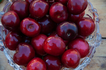 Ripe cherries in a glass vase. High quality photo
