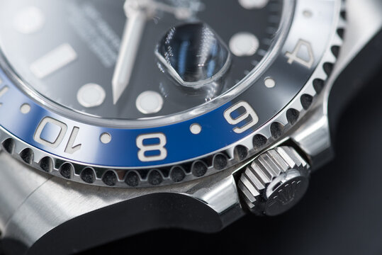 Close up of bezel on Rolex GMT- Master II. Model 116710BLNR with a blue and black ceramic bezel.