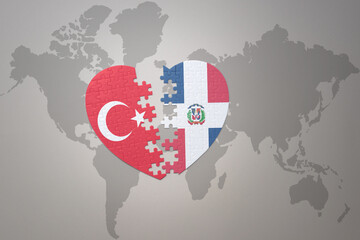 puzzle heart with the national flag of turkey and dominican republic on a world map background. Concept.