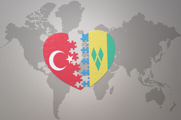 puzzle heart with the national flag of turkey and saint vincent and the grenadines on a world map background. Concept.
