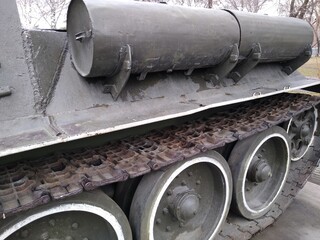 Military equipment, a close-up battle tank on a tracked track
