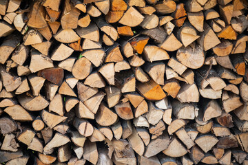 Pile of wood logs storage. Logging for firewood.