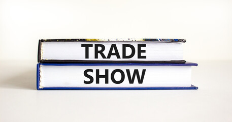 Trade show symbol. Books with concept words Trade show on beautiful white background. Business economic financial trade show concept. Copy space.