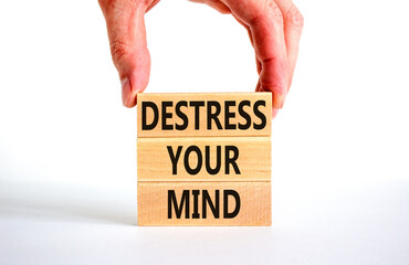 Destress your mind symbol. Concept words Destress your mind on wooden blocks. Doctor hand. Beautiful white table white background. Psychological business and destress your mind concept. Copy space.