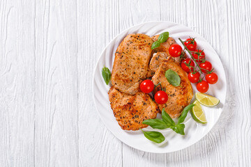 tomato basil pesto fried pork cutlets on plate
